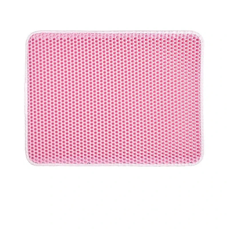 Pink mat with honeycomb design displayed on a white background
