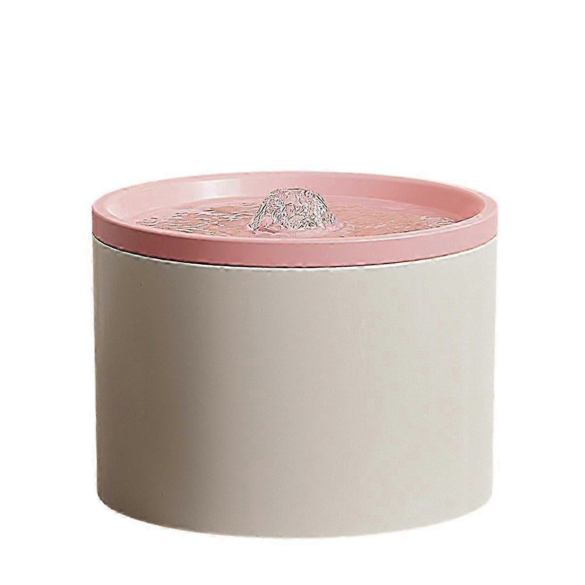 Ceramic water fountain for pets with pink top on a white background.