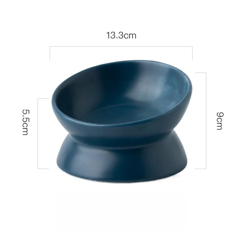 Navy blue ceramic elevated cat bowl with measurements displayed on a white background.