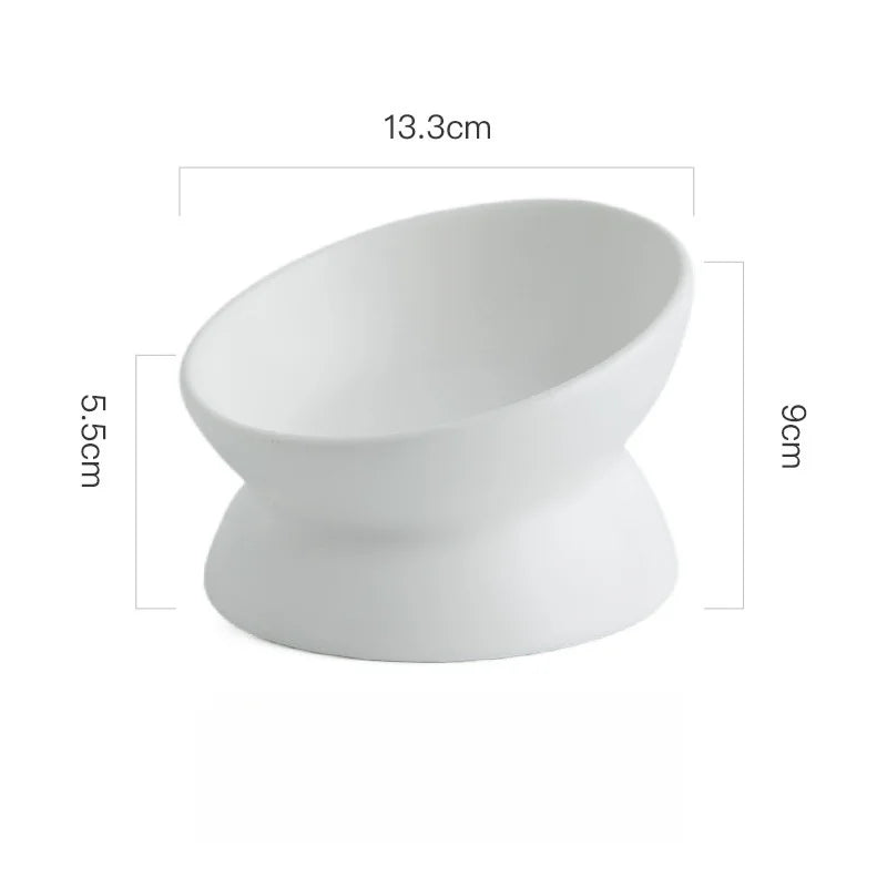 White ceramic elevated cat bowl displayed on a white background with measurements.