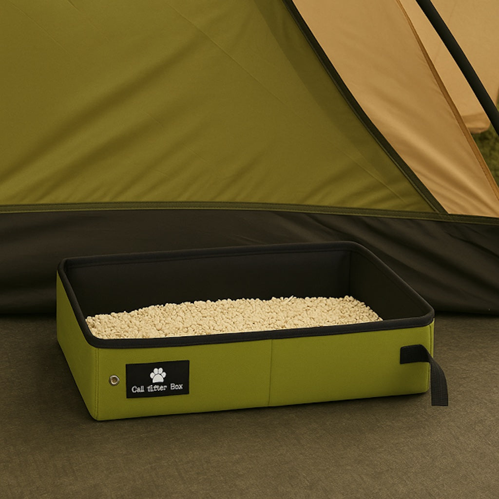 Green collapsible portable cat litter box filled with litter displayed in a tent, showing a versatile solution for travel and outdoor adventures.