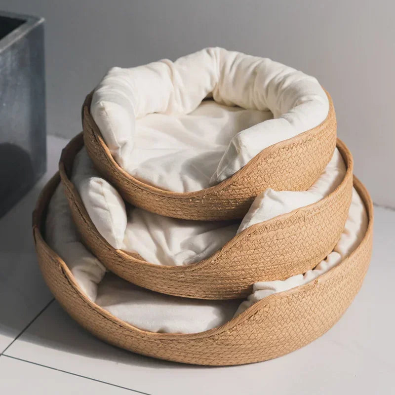 Three eco-friendly cat beds in different size variants displayed together.