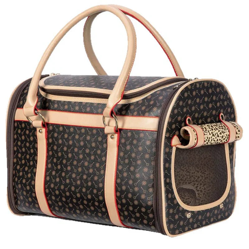 Pet carrier with patterned design and beige accents on a white background.
