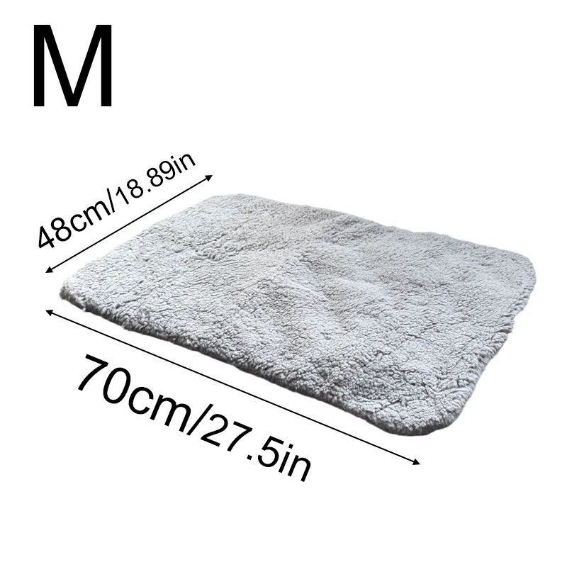 Grey self warming cat bed in medium size displayed with dimensions.