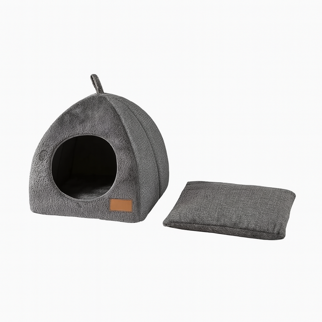 Grey triangular cat cave house with removable washable cushion displayed on a white background.