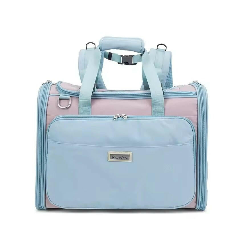 Light blue and pink pet carrier with a visible brand logo on a white background