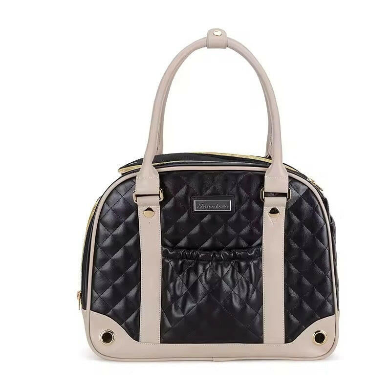 Black quilted handbag with beige handle and trim on a white background