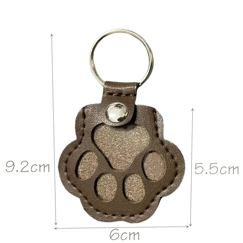 Brown leather pet hair keepsake keyring with its measurement displayed on a white background.