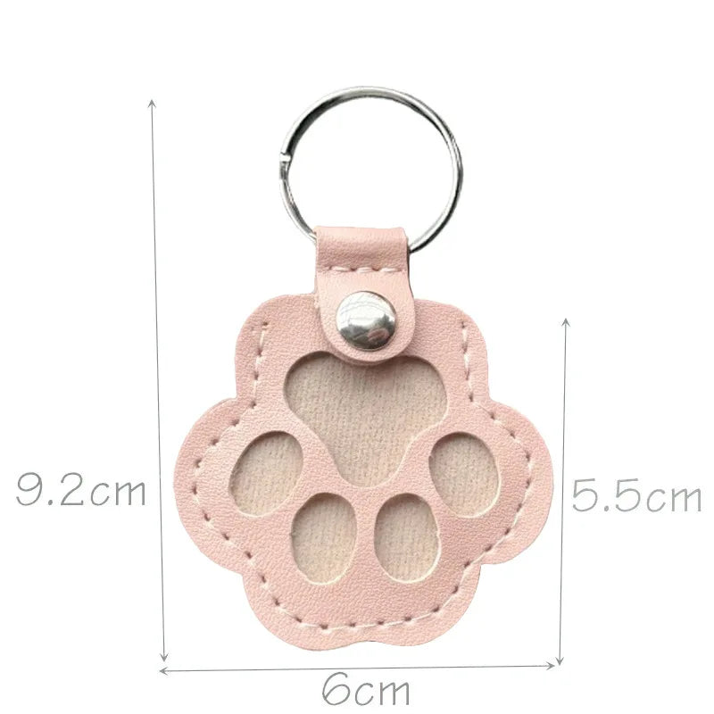 Light pink pet hair memorial keepsake keyring with its measurements displayed on a whitebackground.