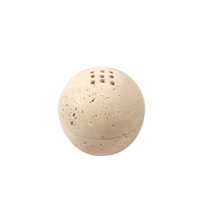 Beige travertine incense holder displayed on a white background.