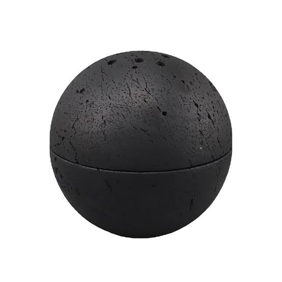 Black travertine incense holder displayed on a white background.