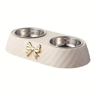White stainless steel cat bowl with a bow design displayed on a white background.