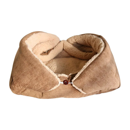 Beige pet bed with a button on a white background