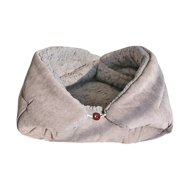 Gray pet bed with a button on a white background