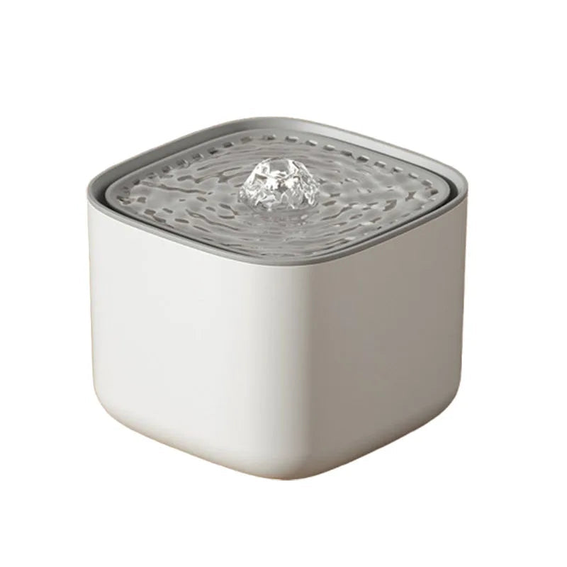 White pet water fountain with grey top displayed on a white background.
