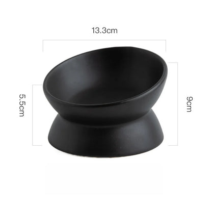 Black ceramic elevated cat bowl displayed with its measurements on a white background.