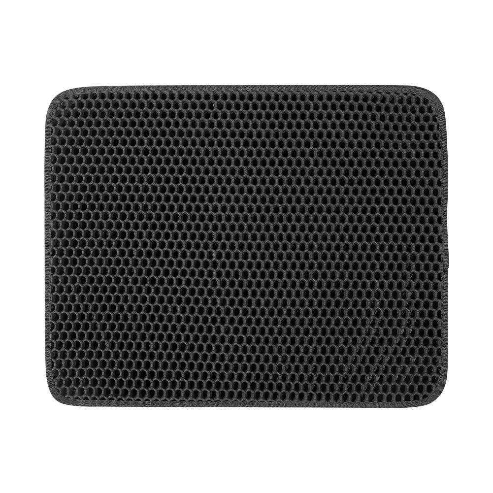 Black honeycomb patterned mat on a white background.