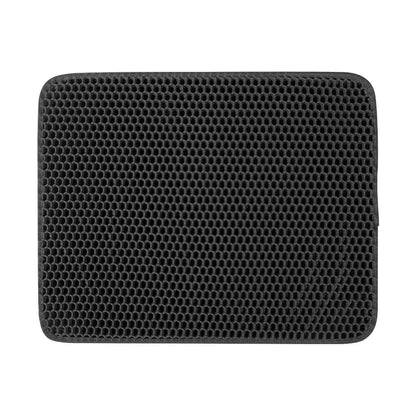 Black honeycomb patterned mat on a white background.