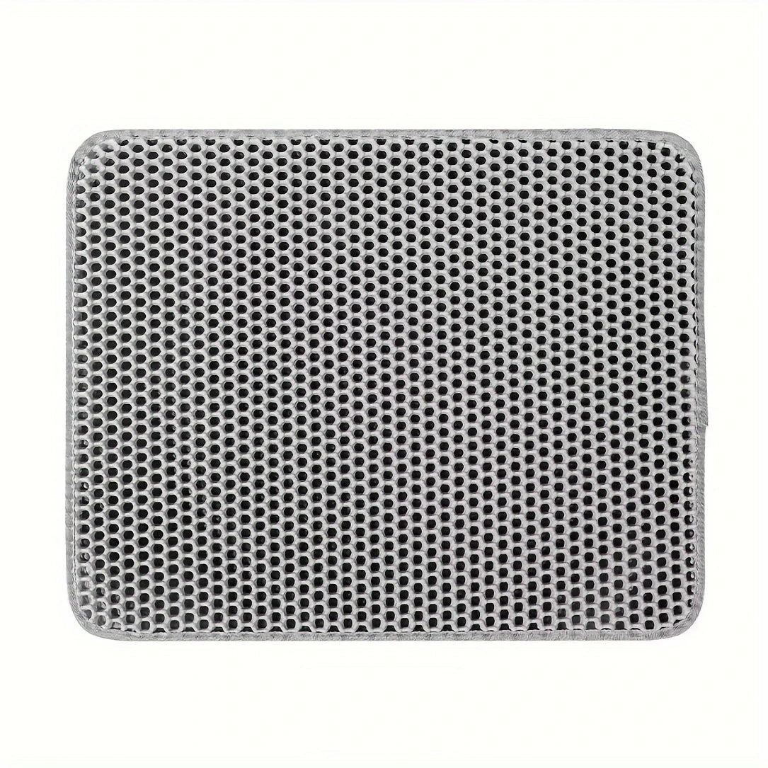 Grey cat litter trapping mat with honeycomb design displayed on a white background.