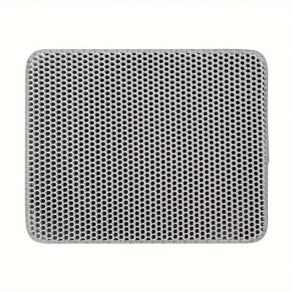 Grey cat litter trapping mat with honeycomb design displayed on a white background.