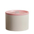 Ceramic water fountain for pets with pink top on a white background.