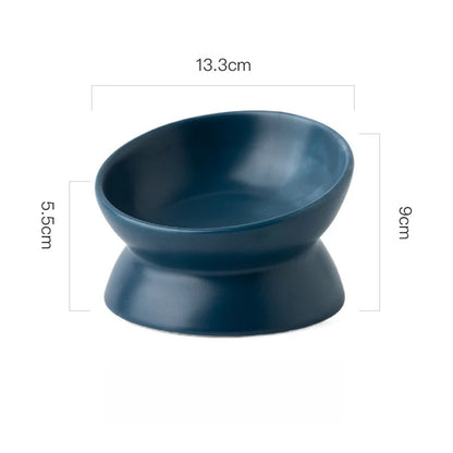 Navy blue ceramic elevated cat bowl with measurements displayed on a white background.