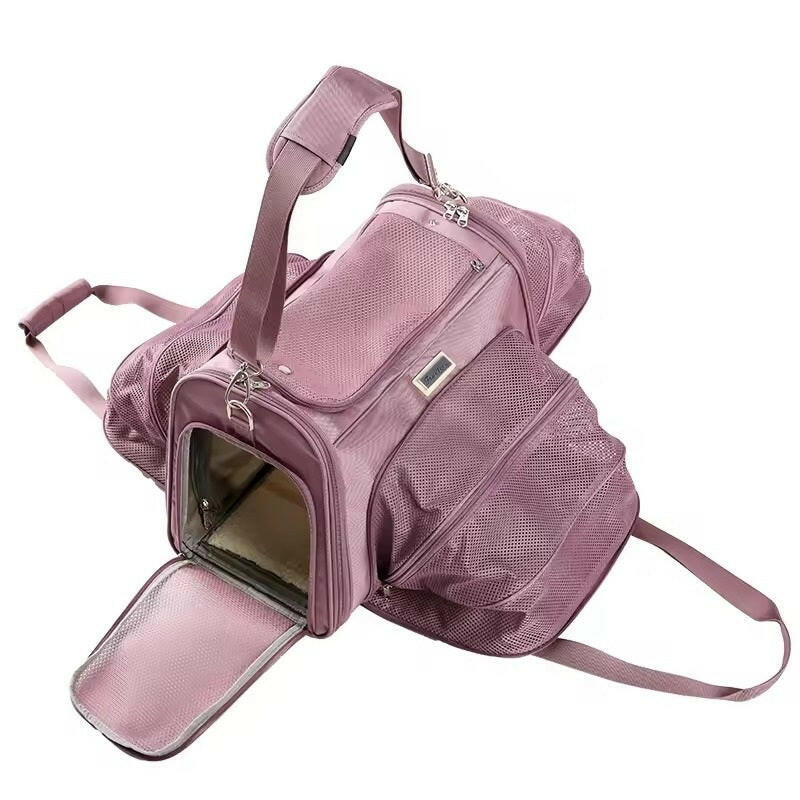 Pink expandable pet carrier with open front door on a white background
