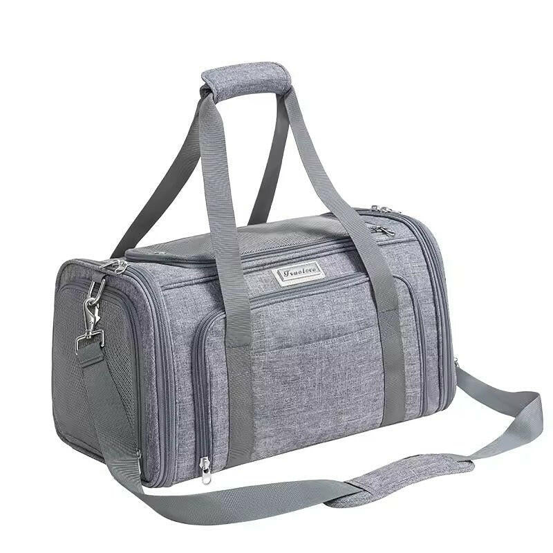 Grey pet carrier bag with shoulder strap on a white background