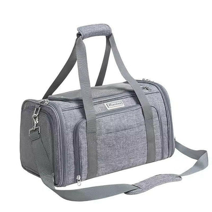 Grey pet carrier bag with shoulder strap on a white background
