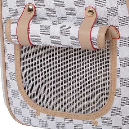 Close-up of a  chequered leather pet carrier with mesh pocket and leather straps.