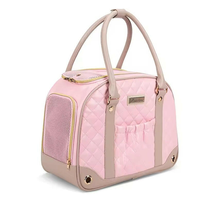 Pink pet carrier with beige handles on a white background
