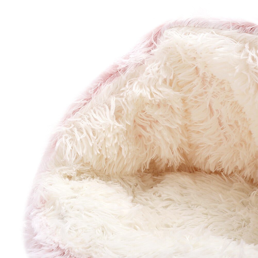 Closeup of a pink semi-enclosed calming cat bed with white interior displayed on a white background.