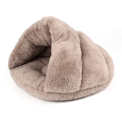 Beige plush igloo cat bed displayed on a white background.
