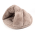 Beige plush igloo cat bed displayed on a white background.
