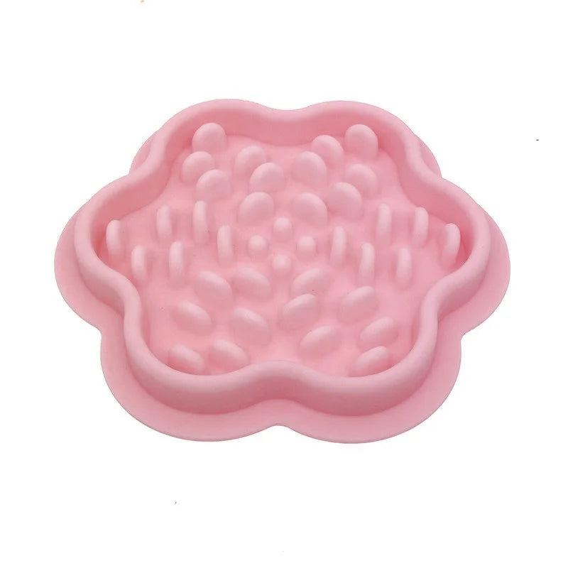 Pink silicone pet slow feeder displayed on a white background.