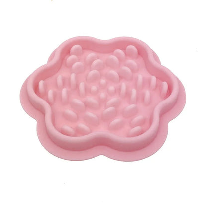Pink silicone pet slow feeder displayed on a white background.