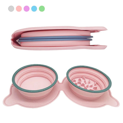 Pink silicone travel pet bowl with textured design and lid on a white background