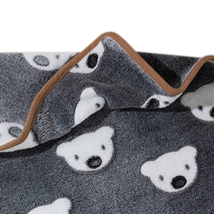 Piglets coral fleece cat blanket with white piglets pattern and brown trim - closeup of soft blanket for cats on white background