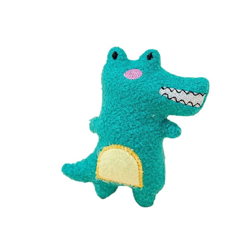 Teal crocodile plush toy for cats with a yellow belly on a white background