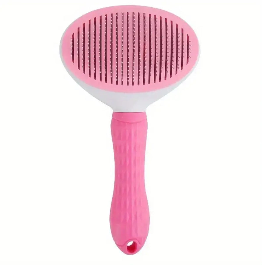 Front view of pink stainless-steel self-cleaning slicker brush with rounded metal bristles and plastic grip.