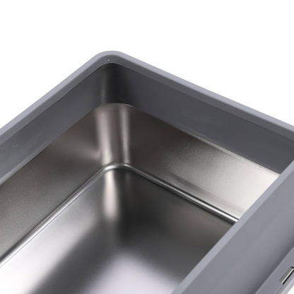 Closeup of a stainless steel tray; a part of a premium enclosed cat litter box on a white background.