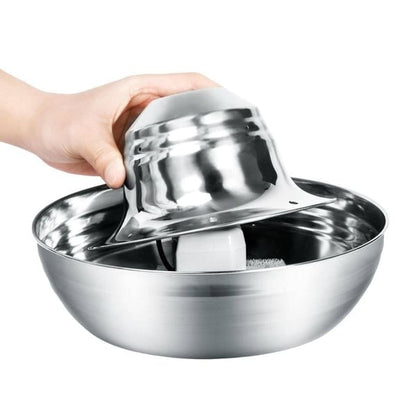 An element of stainless steel water fountain held by a hand on a white background
