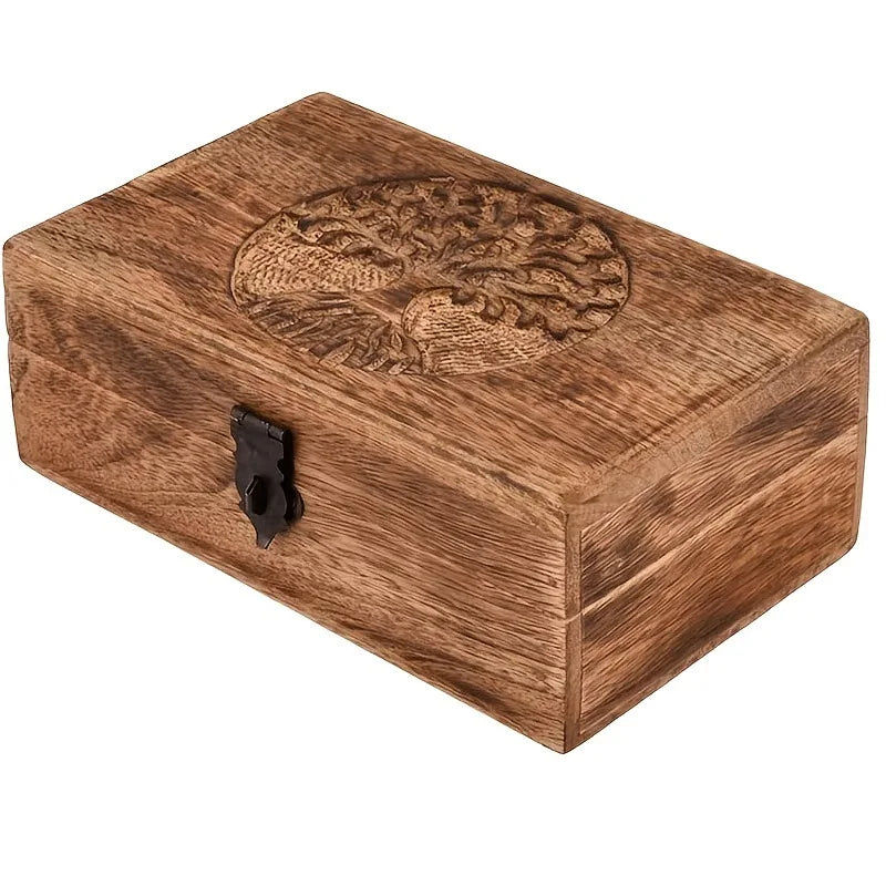 Wooden memorial box with engraved tree of life motif displayed on a white background.